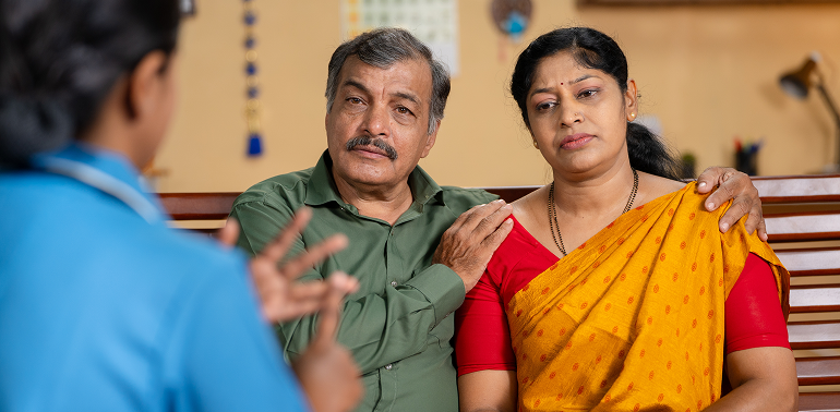 Nurse explaining care to family